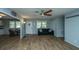 Spacious living area with wood-look flooring and natural light, leading to the dining area and kitchen at 565 Estates Dr, Walterboro, SC 29488