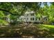 Spacious backyard with mature trees, providing shade and a serene atmosphere for outdoor enjoyment at 6 Sayle Rd, Charleston, SC 29407