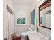 Bright bathroom featuring white fixtures, patterned tile, and natural light from a window at 6 Sayle Rd, Charleston, SC 29407
