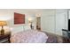 Comfortable bedroom with a large patterned bed, bright lighting, and ample closet space at 6 Sayle Rd, Charleston, SC 29407