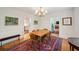 Inviting dining room with hardwood floors, a wooden table, and doorways leading to other rooms at 6 Sayle Rd, Charleston, SC 29407
