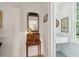 Hallway with stylish decor leading to a bathroom with marble countertop at 6 Sayle Rd, Charleston, SC 29407