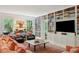 Living room features stylish furniture, shelving, and natural light from the windows at 6 Sayle Rd, Charleston, SC 29407