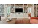 Spacious living room with floor to ceiling shelving and a view to the bar area at 6 Sayle Rd, Charleston, SC 29407