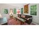 Inviting living room with a comfortable couch, bright windows, and stylish decor and rug at 6 Sayle Rd, Charleston, SC 29407