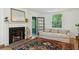 Cozy living room with fireplace, hardwood floors, and a comfortable sofa at 6 Sayle Rd, Charleston, SC 29407