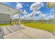 Spacious backyard featuring a pergola-covered patio, fire pit, and well-maintained lawn at 602 Yellow Leaf Ln, Summerville, SC 29486