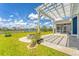 Inviting backyard with a pergola, fire pit, and lush green lawn overlooking a pond at 602 Yellow Leaf Ln, Summerville, SC 29486
