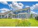 Backyard view of the house showing a screened porch, patio, and fire pit area at 602 Yellow Leaf Ln, Summerville, SC 29486
