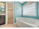 Bathroom showing soaking tub, modern faucet, and decorative wall art at 602 Yellow Leaf Ln, Summerville, SC 29486