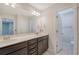 Bathroom with double sink vanity and dark cabinets plus an entry to separate toilet at 602 Yellow Leaf Ln, Summerville, SC 29486
