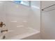 Bathroom view of the white bath tub with chrome fixtures and a window at 602 Yellow Leaf Ln, Summerville, SC 29486