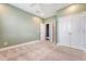 Bedroom with neutral carpet, closet with double doors, and access to ensuite bath at 602 Yellow Leaf Ln, Summerville, SC 29486