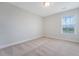 A carpeted bedroom with neutral walls and a window offering natural light at 602 Yellow Leaf Ln, Summerville, SC 29486