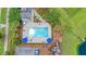 Aerial view of a relaxing community pool area with umbrellas, seating, and playground at 602 Yellow Leaf Ln, Summerville, SC 29486