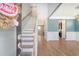 Bright and airy foyer with hardwood floors, staircase, and views into other living spaces at 602 Yellow Leaf Ln, Summerville, SC 29486