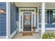 Close-up of a welcoming front door, enhanced by a decorative wreath, flowers, and charming seasonal accents at 602 Yellow Leaf Ln, Summerville, SC 29486