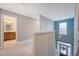 Well-lit hallway leading to a bathroom, with view of entryway and natural light at 602 Yellow Leaf Ln, Summerville, SC 29486