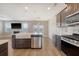 Well-equipped kitchen featuring an island, stainless steel appliances, and a view of the backyard at 602 Yellow Leaf Ln, Summerville, SC 29486