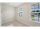 Laundry room with tiled floors and natural lighting through windows at 602 Yellow Leaf Ln, Summerville, SC 29486