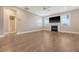 Spacious living room featuring hardwood floors, a fireplace, and large windows at 602 Yellow Leaf Ln, Summerville, SC 29486