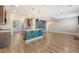 Open floor plan showcasing the kitchen island, dining area, and living room with fireplace at 602 Yellow Leaf Ln, Summerville, SC 29486