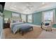 Bright main bedroom with tray ceilings, ample natural light, and calming decor at 602 Yellow Leaf Ln, Summerville, SC 29486
