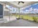 View of a screened in back porch area with ceiling fan and views of the back yard at 602 Yellow Leaf Ln, Summerville, SC 29486