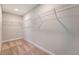 Spacious walk-in closet with ample shelving and neutral carpeting at 602 Yellow Leaf Ln, Summerville, SC 29486
