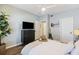 Well-lit bedroom featuring a queen-sized bed, a ceiling fan, and a flat-screen TV atop a dresser at 700 Daniel Ellis Dr # 5103, James Island, SC 29412