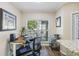 Bright home office area features a stand-up desk, comfortable chair, and natural light at 700 Daniel Ellis Dr # 5103, James Island, SC 29412