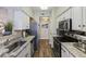 Galley kitchen featuring stainless steel appliances and granite countertops at 700 Daniel Ellis Dr # 5103, James Island, SC 29412