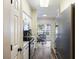 Galley-style kitchen with white cabinets, stainless steel appliances, and hardwood floors at 700 Daniel Ellis Dr # 5103, James Island, SC 29412