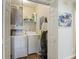 Convenient laundry room with washer, dryer, storage shelves, and stylish decor at 700 Daniel Ellis Dr # 5103, James Island, SC 29412