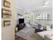 Bright living room with wood floors, comfortable seating, and a view to the outside at 700 Daniel Ellis Dr # 5103, James Island, SC 29412