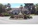Exterior view of a community center featuring a water fountain and lush landscaping at 700 Daniel Ellis Dr # 5103, James Island, SC 29412