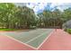 Community tennis court surrounded by trees at 700 Daniel Ellis Dr # 5103, James Island, SC 29412