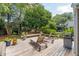 Relaxing back deck with lounge chairs, grill, and views of the lush backyard at 708 Lawton Harbor Dr, Charleston, SC 29412