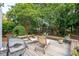 Spacious deck featuring lounge chairs, a grill, and a beautifully landscaped backyard at 708 Lawton Harbor Dr, Charleston, SC 29412