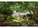 Expansive backyard with multi-level deck, lush landscaping, and mature trees at 708 Lawton Harbor Dr, Charleston, SC 29412