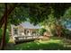 Picturesque backyard view featuring a deck with lounge chairs and shaded seating area at 708 Lawton Harbor Dr, Charleston, SC 29412