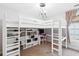 Bedroom with a bunk bed, shelving, a built-in desk area and window at 708 Lawton Harbor Dr, Charleston, SC 29412