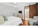 Bright bedroom with a modern dresser, access to the bathroom, and a comfortable chair, creating a relaxing retreat at 708 Lawton Harbor Dr, Charleston, SC 29412