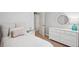 Bright bedroom featuring a dresser with decor, a nightstand, and neutral color scheme at 708 Lawton Harbor Dr, Charleston, SC 29412