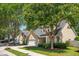 Charming home with a well-manicured lawn, mature trees, and a welcoming two-car garage at 708 Lawton Harbor Dr, Charleston, SC 29412