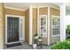 Welcoming front porch with stylish door, decorative plants, and neat exterior siding at 708 Lawton Harbor Dr, Charleston, SC 29412