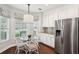 Charming eat-in kitchen featuring a stainless steel refrigerator and a breakfast nook with a large window at 708 Lawton Harbor Dr, Charleston, SC 29412
