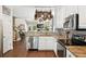 Open kitchen with stainless steel appliances, granite countertops, and a pot rack, perfect for culinary enthusiasts at 708 Lawton Harbor Dr, Charleston, SC 29412