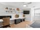 Office space with long white desk and storage with wall decor and a ceiling fan at 708 Lawton Harbor Dr, Charleston, SC 29412