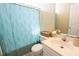 Bathroom with light blue shower curtain, white fixtures, and neutral wall color at 714 Alwyn Blvd, Summerville, SC 29485